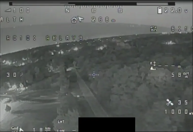 Night view downlinked from the aircraft with the flight overlay across it.