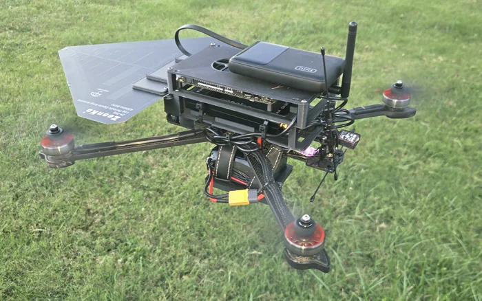 The direction-finding payload on its aircraft: the log-periodic antenna, the sensor stack and its battery.